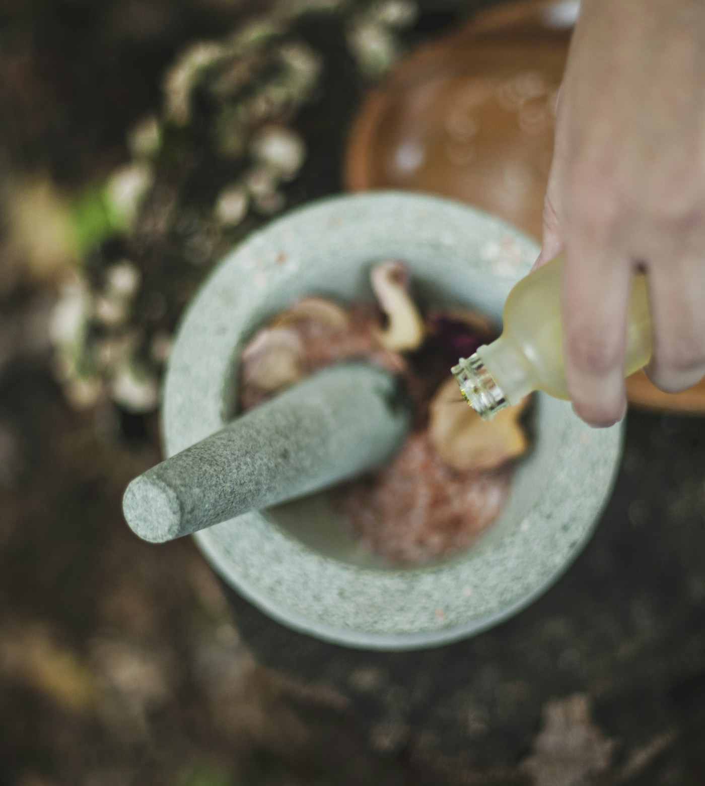 Preparing classical Ayurvedic medicine with mortar and pestle