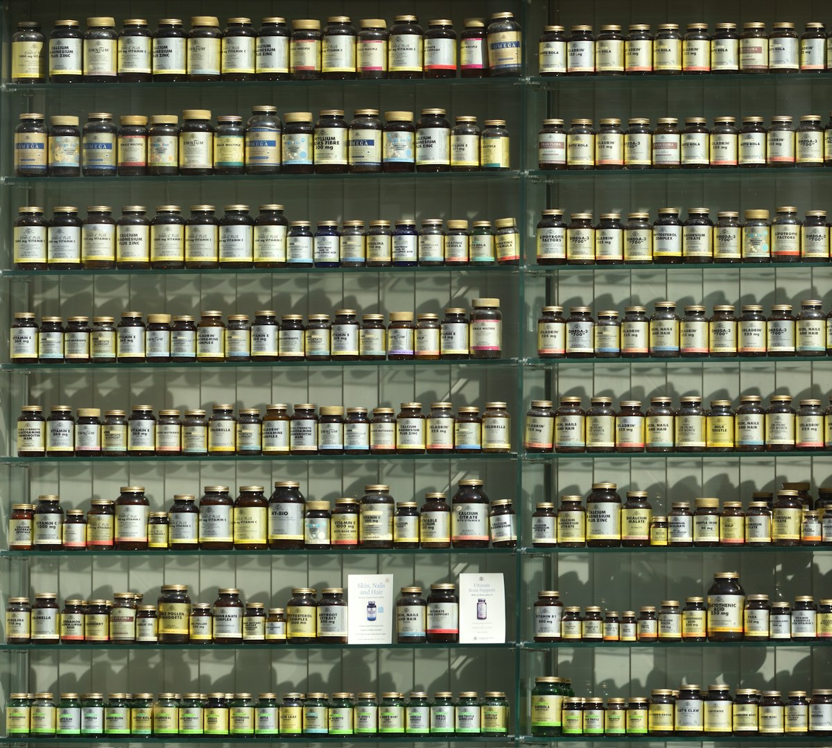 Labelled classical medicines on dispensary shelves